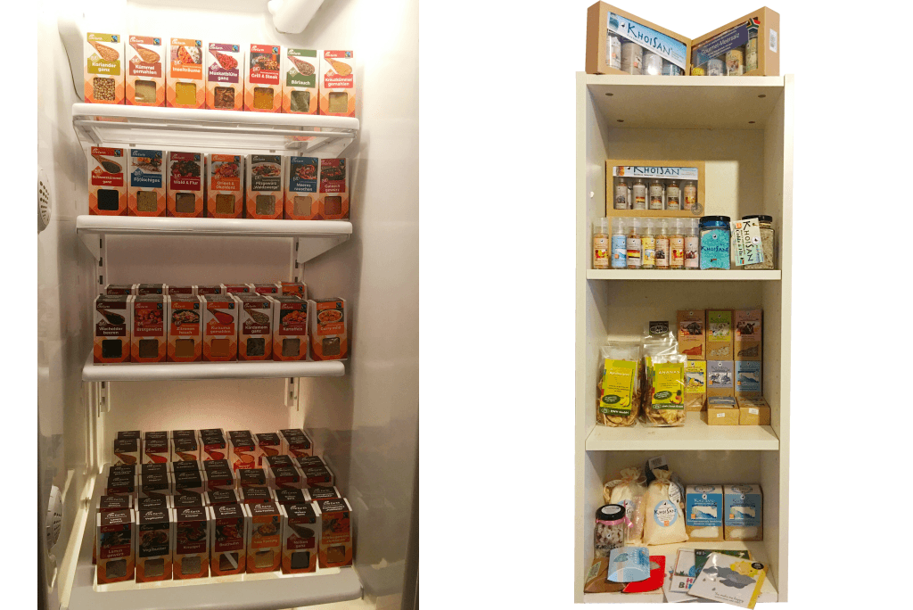 URFair Shop Selbstabholung Sortiment Life Earth Gewürze im Kühlschrank-Regal & Khoi San Salze, Bio Uganda Trockenfrüchte & Cards from Africa Grußkarten im Regal